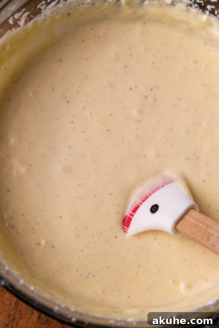 Eggnog Dream Cheesecake 4 Cheesecake batter in a bowl.