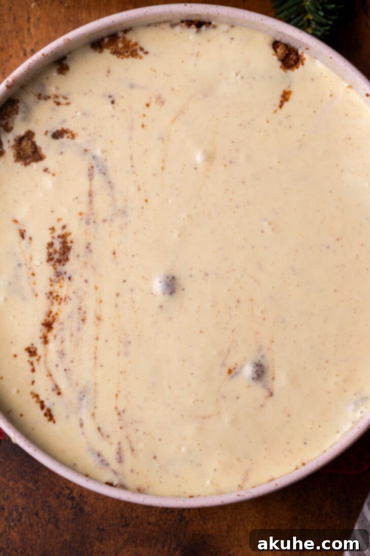 Eggnog Dream Cheesecake 6 Cheesecake batter in a pan.