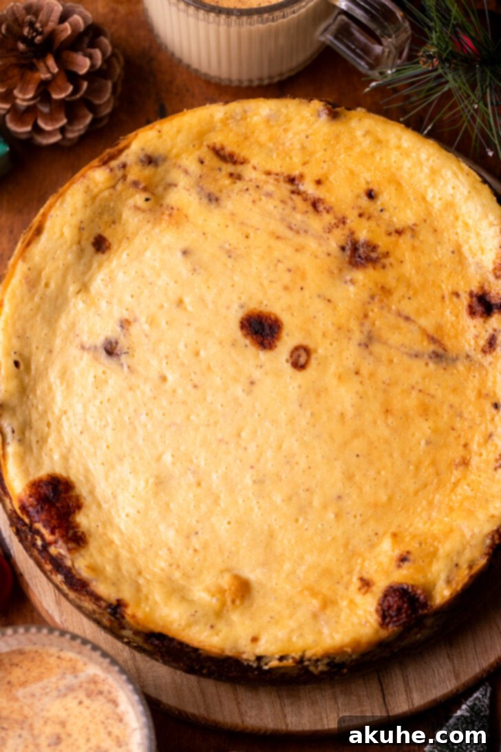 Eggnog Dream Cheesecake 7 Baked cheesecake on a platter.