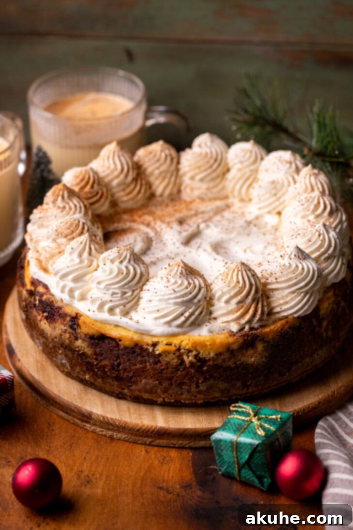 Eggnog Dream Cheesecake 8 Decorated cheesecake on a wood platter.