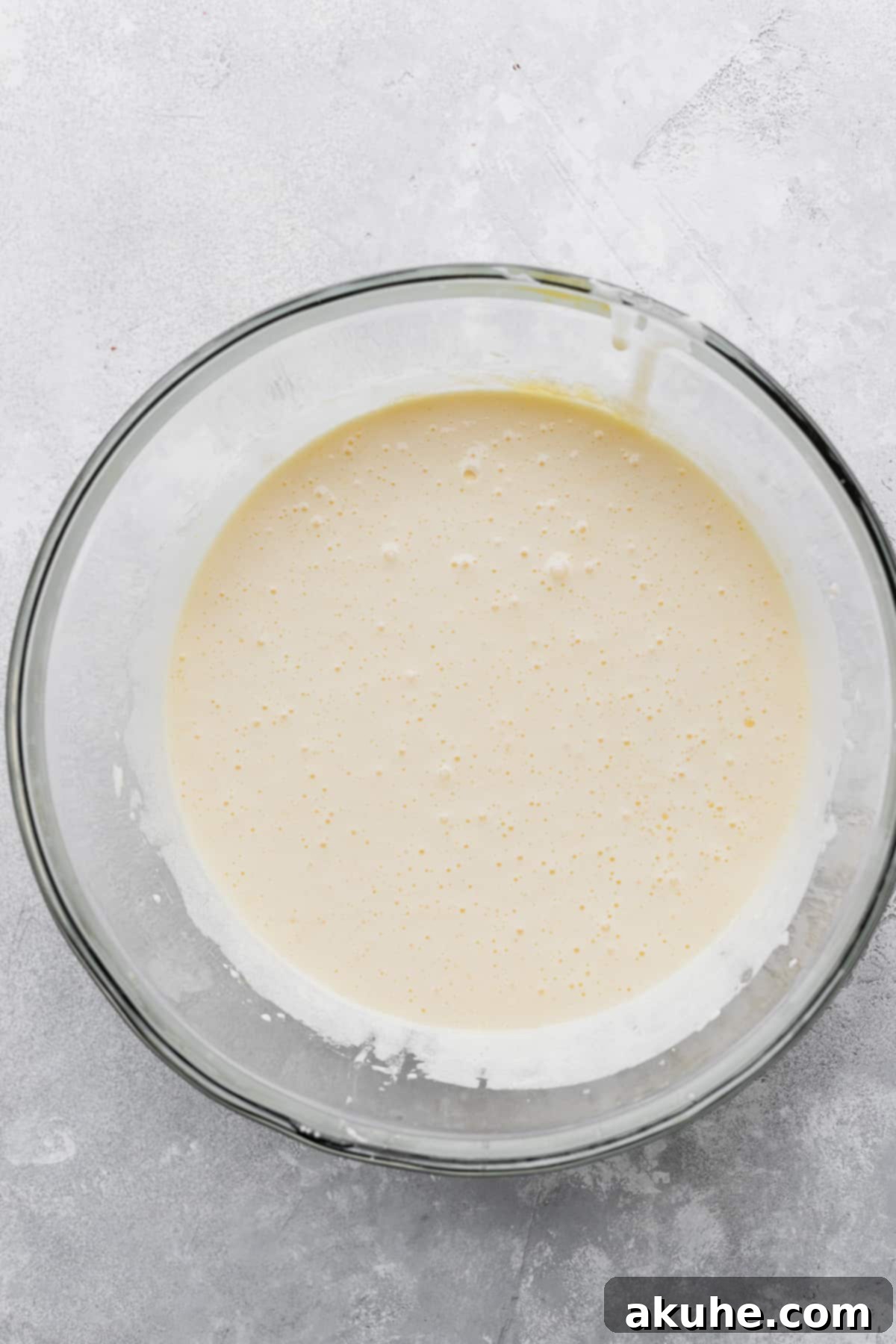 Decadent Marshmallow Brownies 4 Sugar, eggs, and egg yolk whipped to a pale, fluffy consistency in a mixing bowl.