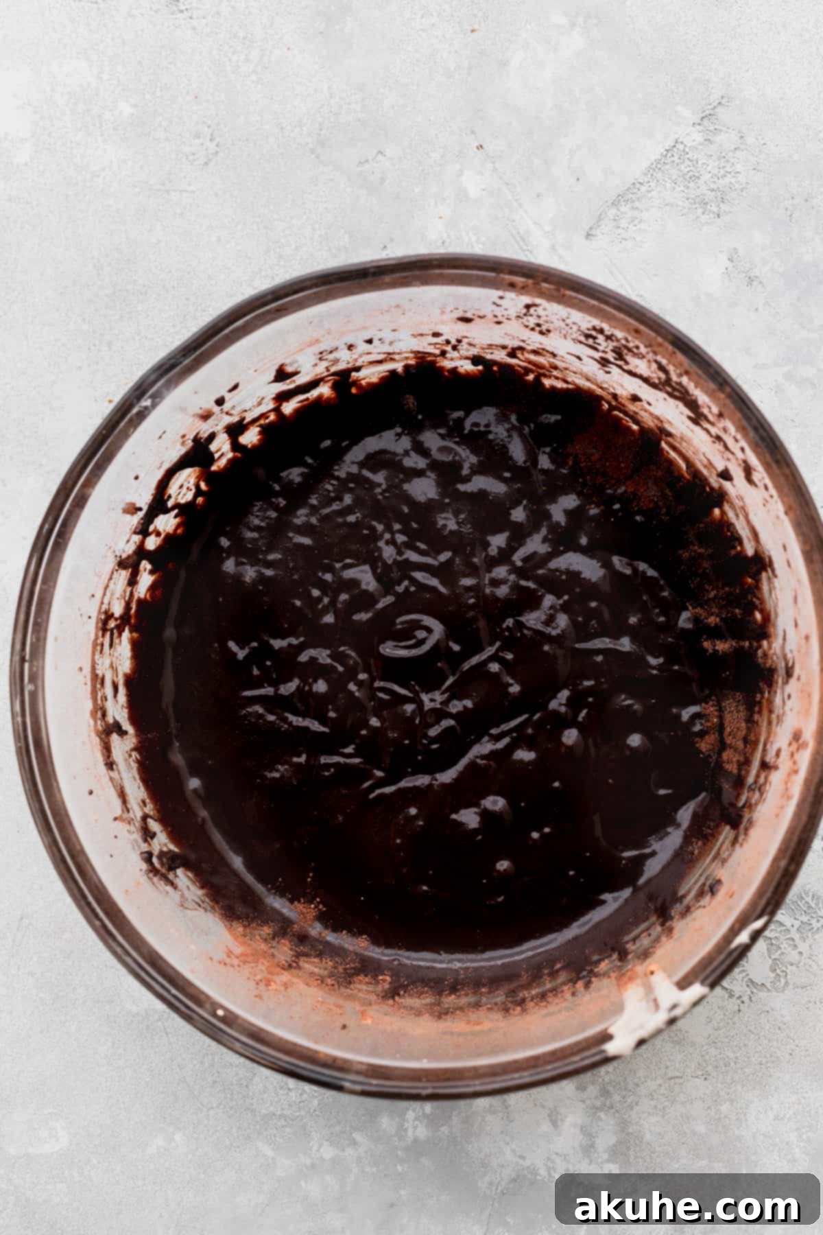 Decadent Marshmallow Brownies 5 Rich chocolate brownie batter mixed and ready for baking in a glass bowl.