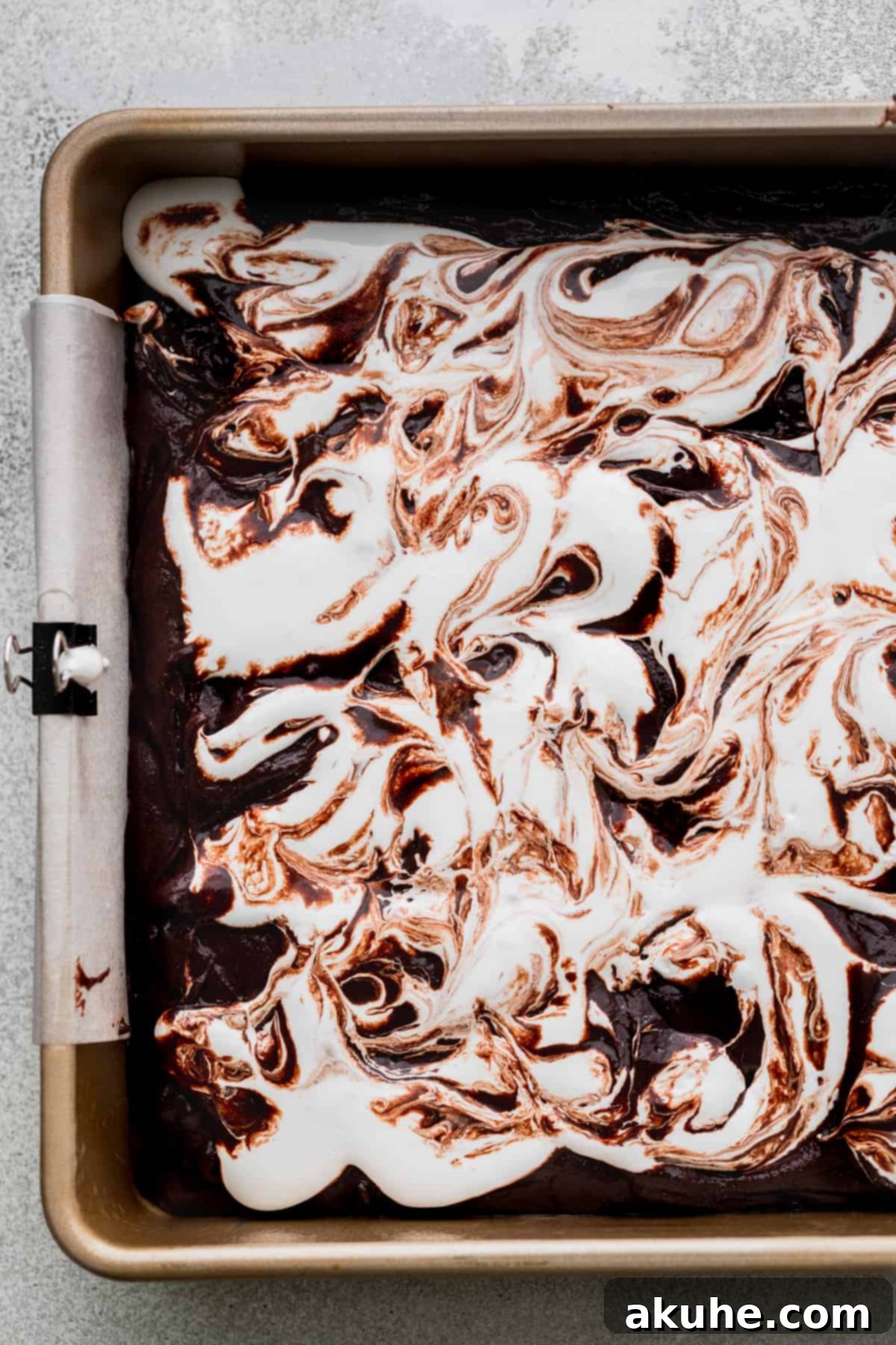 Decadent Marshmallow Brownies 8 Marshmallow fluff beautifully swirled into the brownie batter, creating a marbled effect before baking.