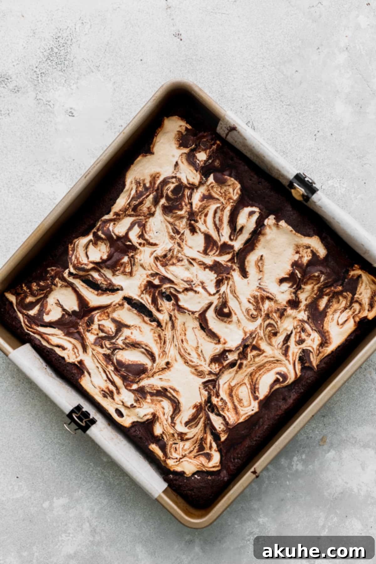 Decadent Marshmallow Brownies 9 Freshly baked marshmallow swirl brownies in the pan, displaying their crackly tops.