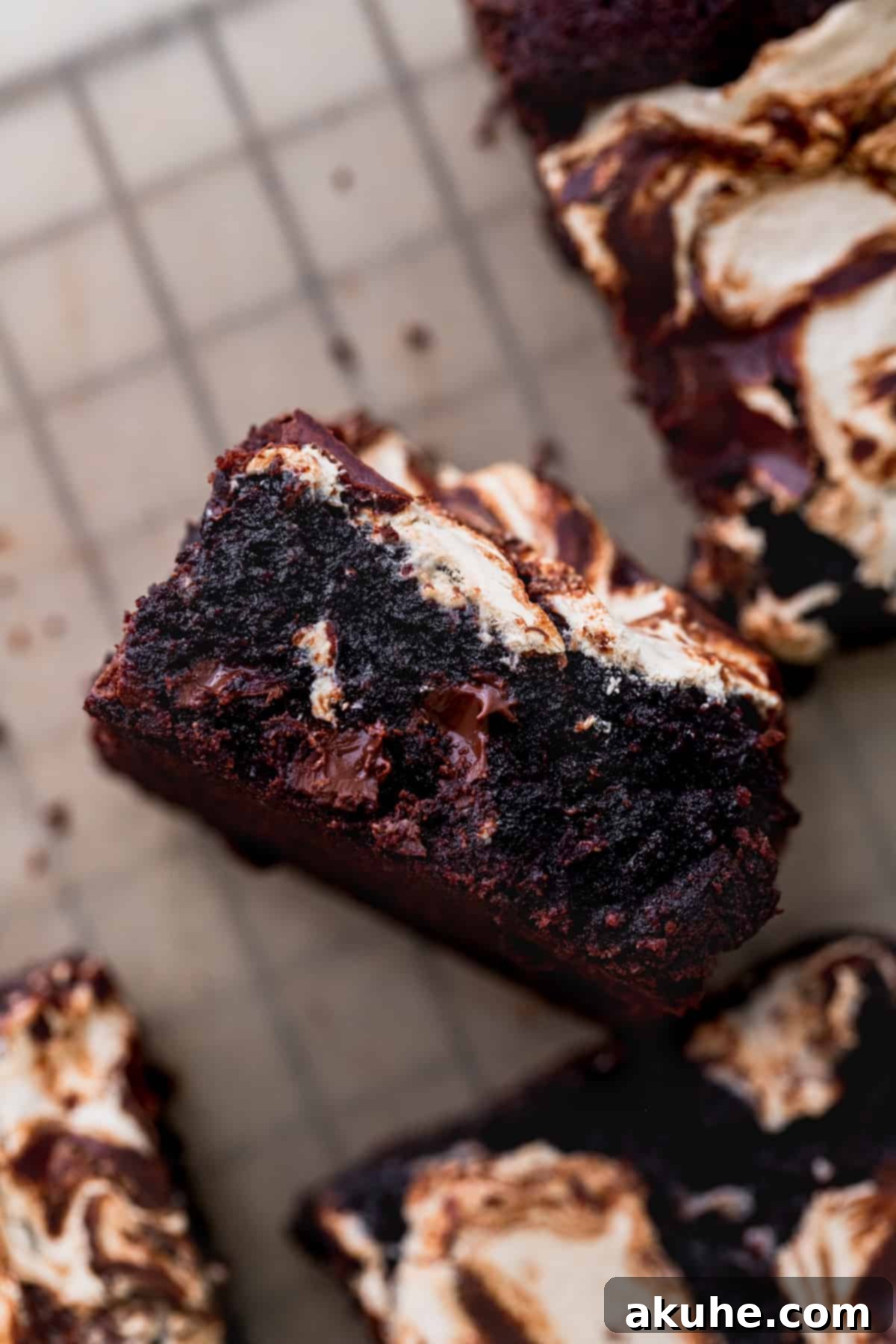 Decadent Marshmallow Brownies 10 A single marshmallow swirl brownie, cut perfectly and standing on its side, showcasing its layers.