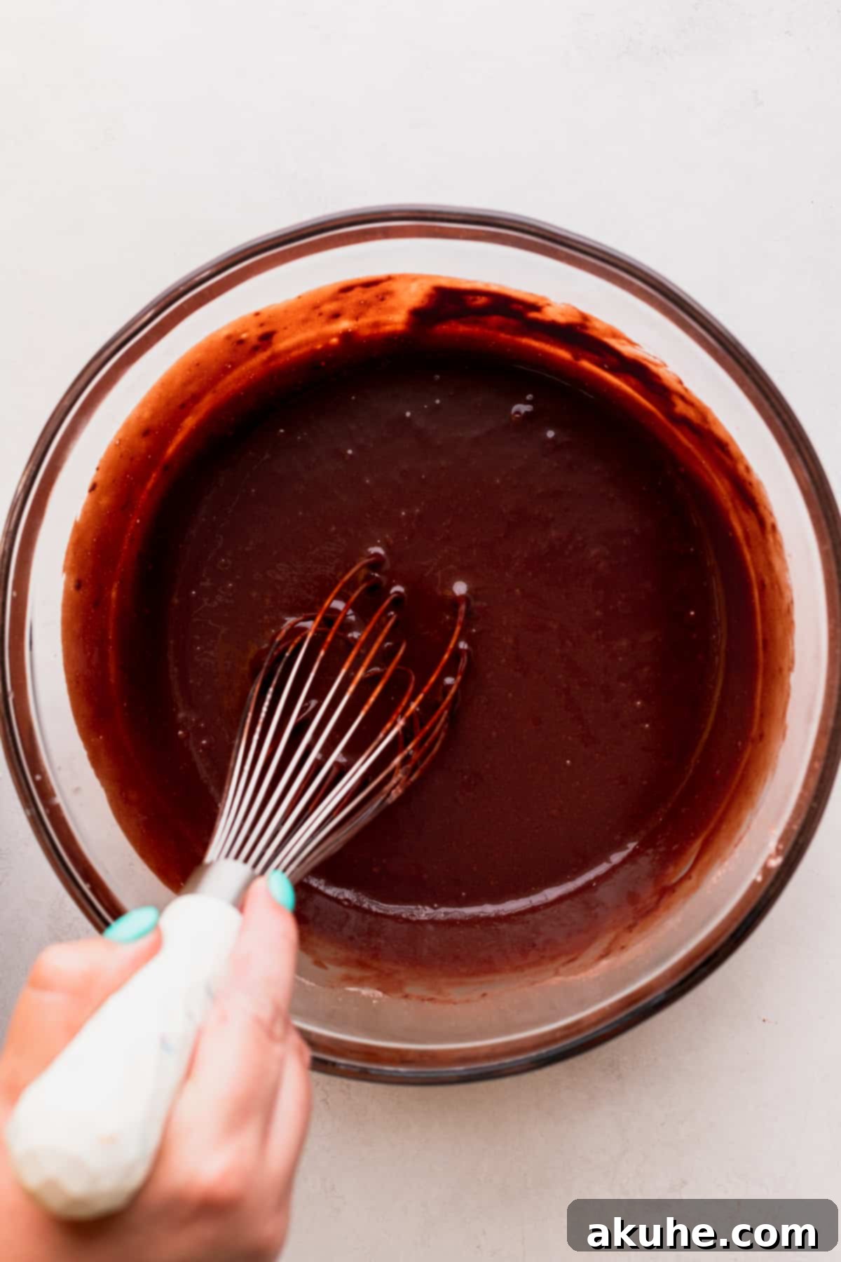 Smooth chocolate cake batter ready for baking.