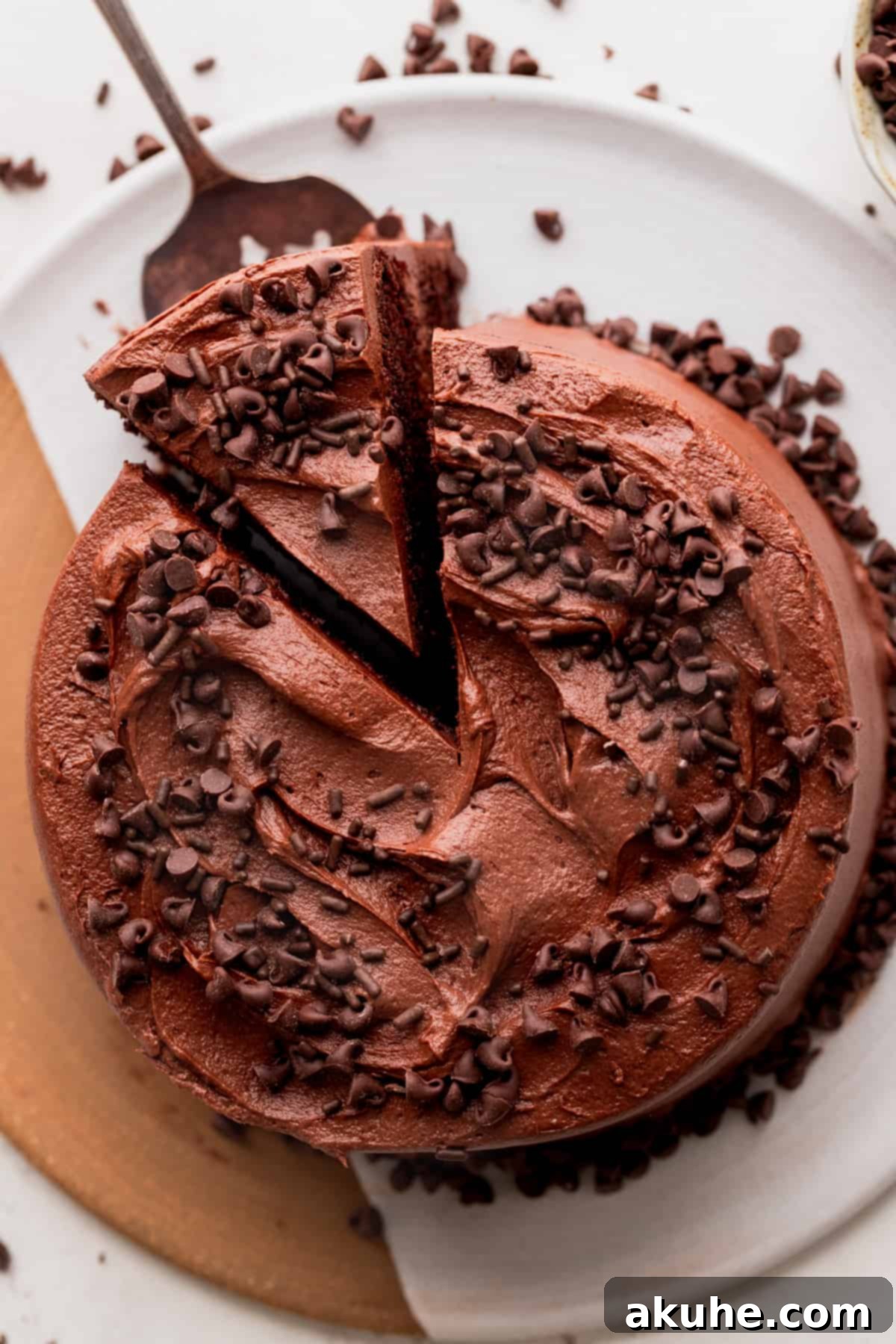 Top of the mini chocolate cake with a slice carefully removed.