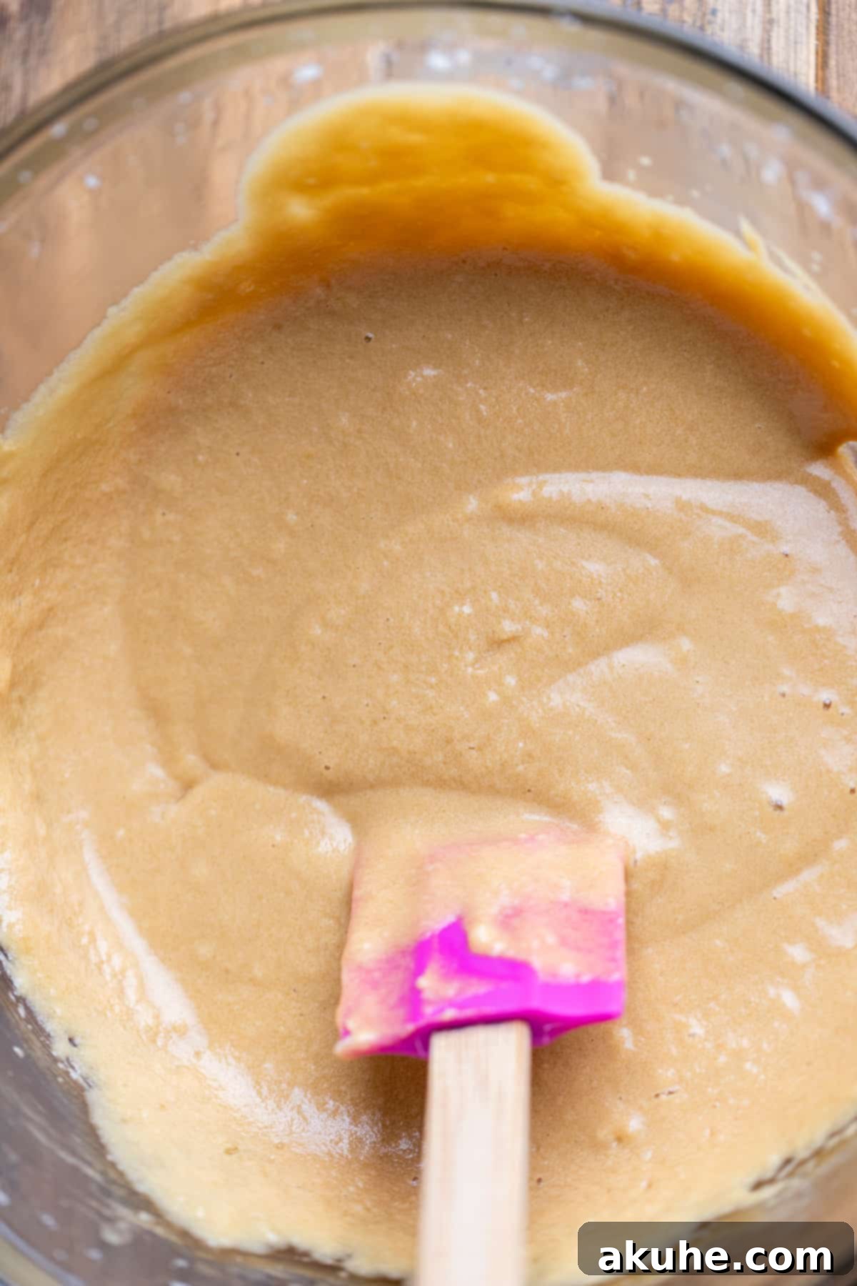 Maple Bacon Bliss Cupcakes 4 Close-up of a glass bowl holding the combined wet ingredients for the maple cupcake batter.