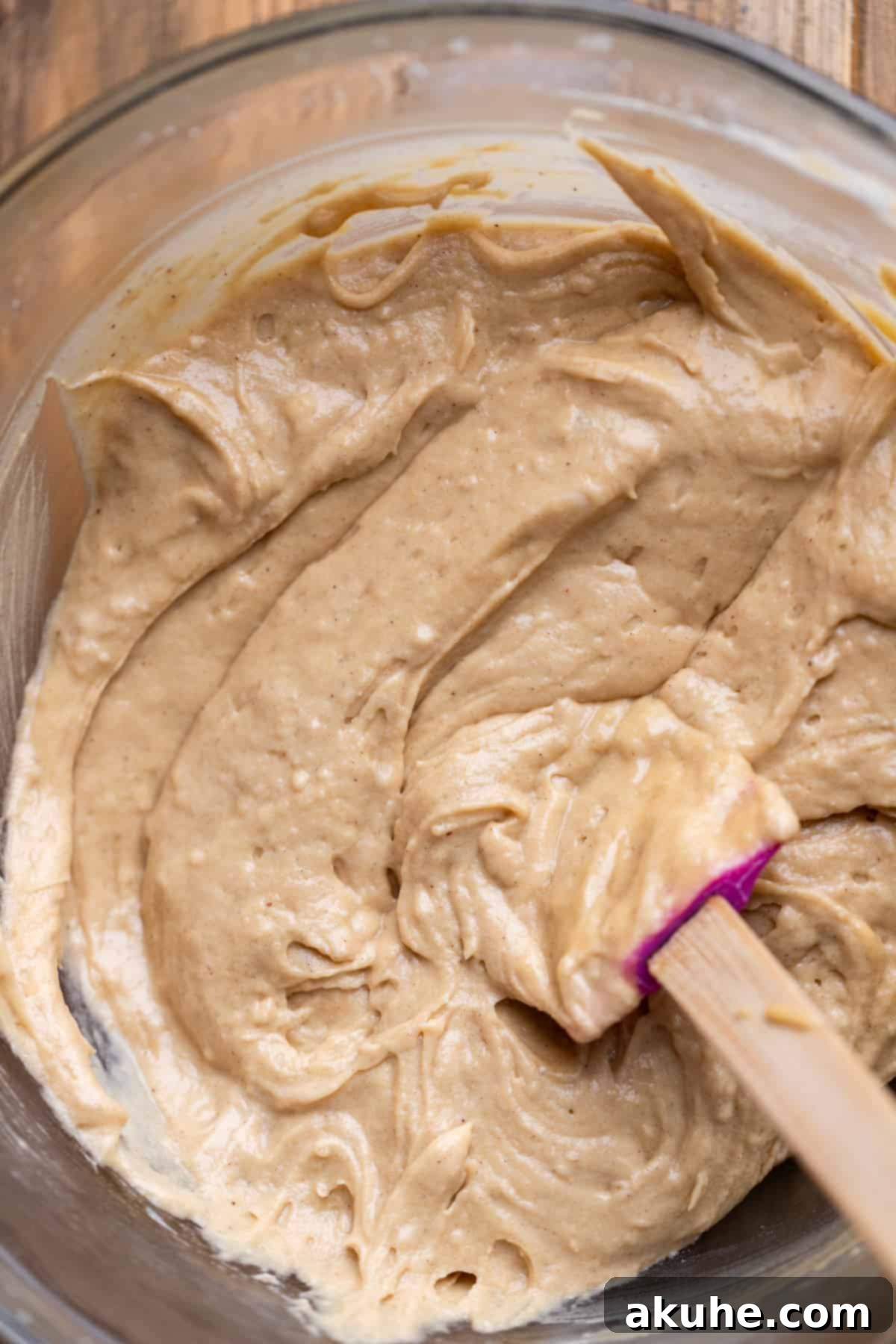 Maple Bacon Bliss Cupcakes 5 Smooth, light brown maple cake batter in a clear glass mixing bowl, ready for dry ingredients.