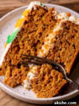 Heavenly Carrot Cake 12 One slice of the best carrot cake with a fork inserted.