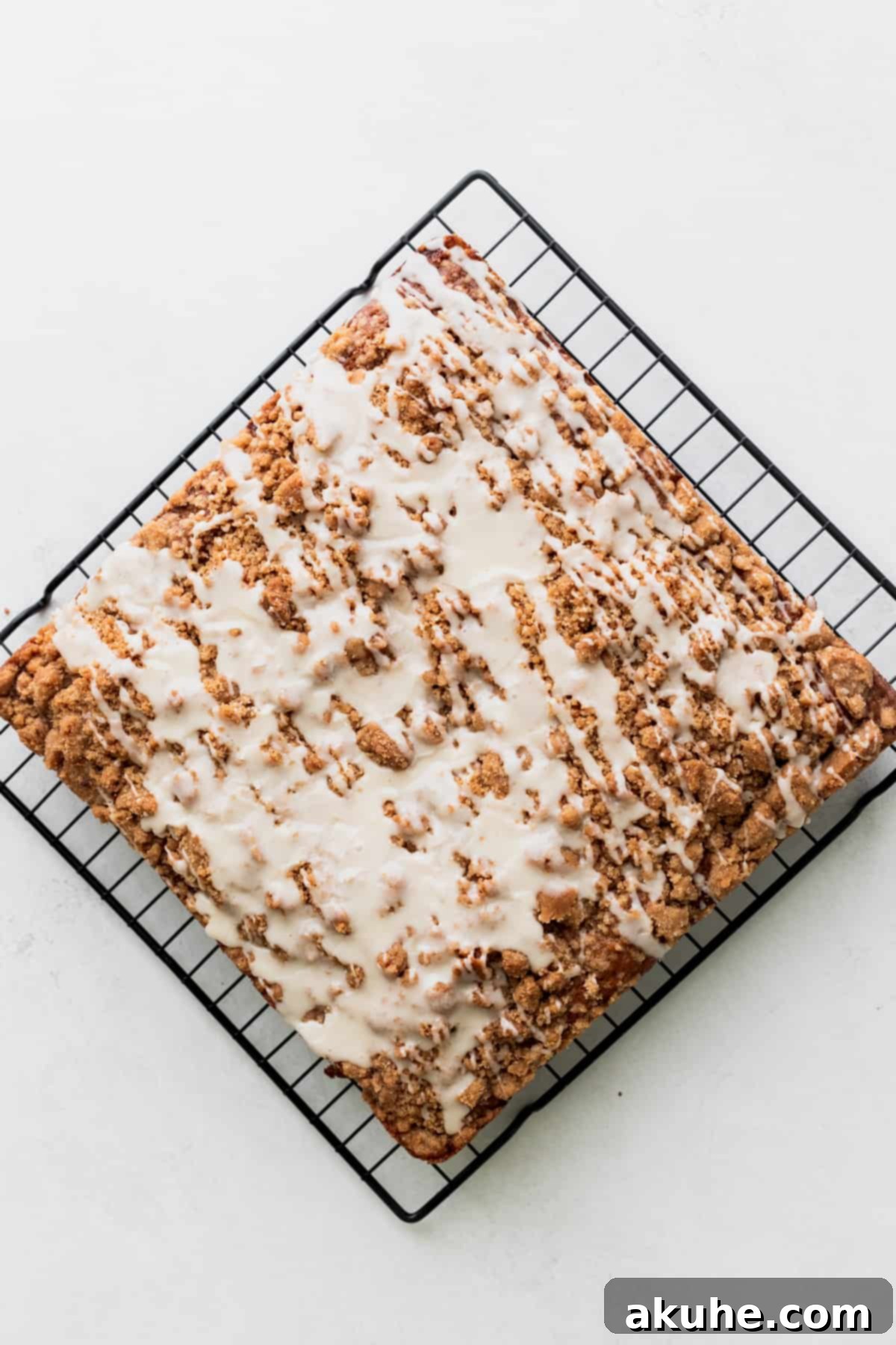 Banana Bread Streusel Coffee Cake 11 Glaze on top of the coffee cake.