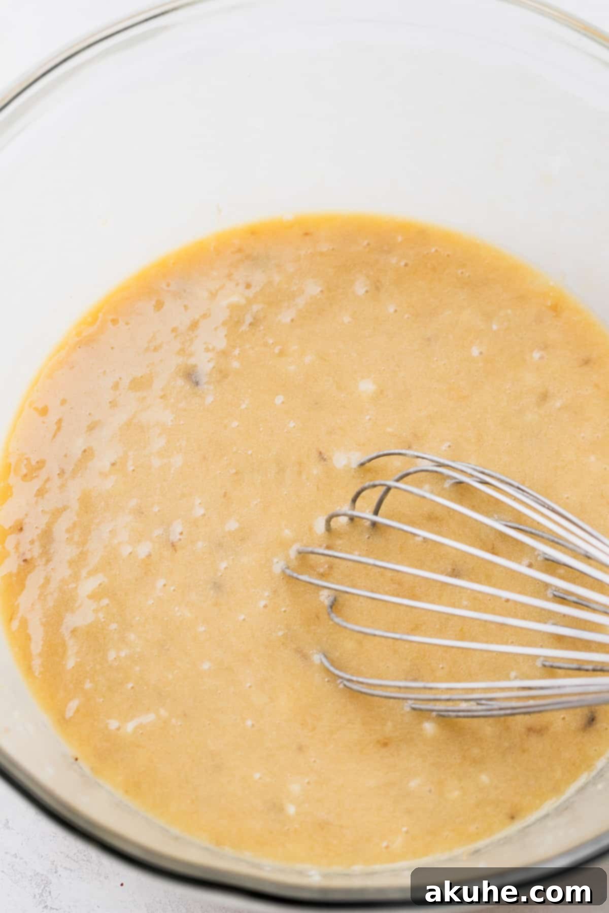Banana Bread Streusel Coffee Cake 5 Wet ingredients in a bowl.