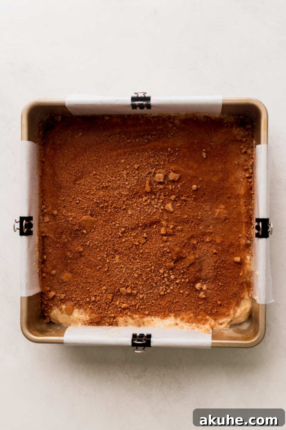 Banana Bread Streusel Coffee Cake 7 Cinnamon filling on top of batter in a pan.