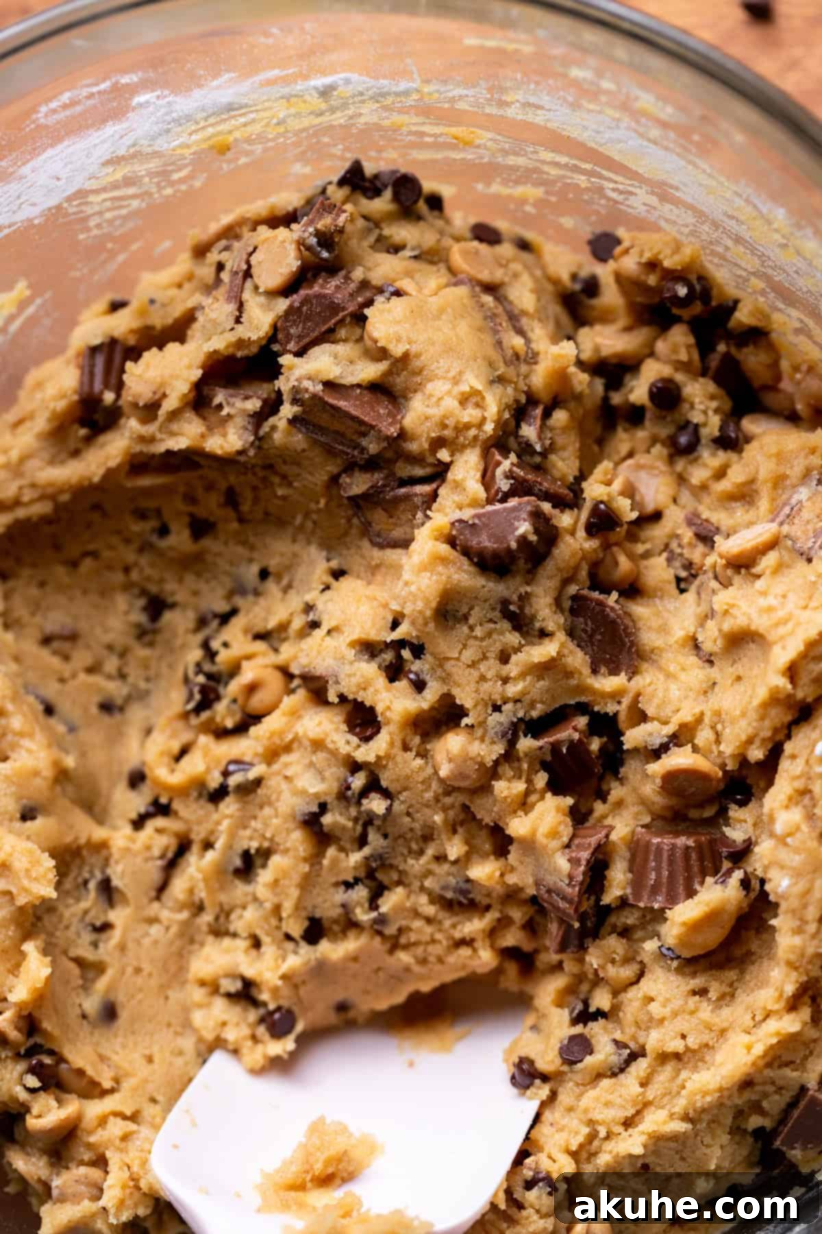 Ultimate Reese's Peanut Butter Chip Cookies 6 Fully mixed peanut butter cookie dough in a glass bowl, ready for scooping.
