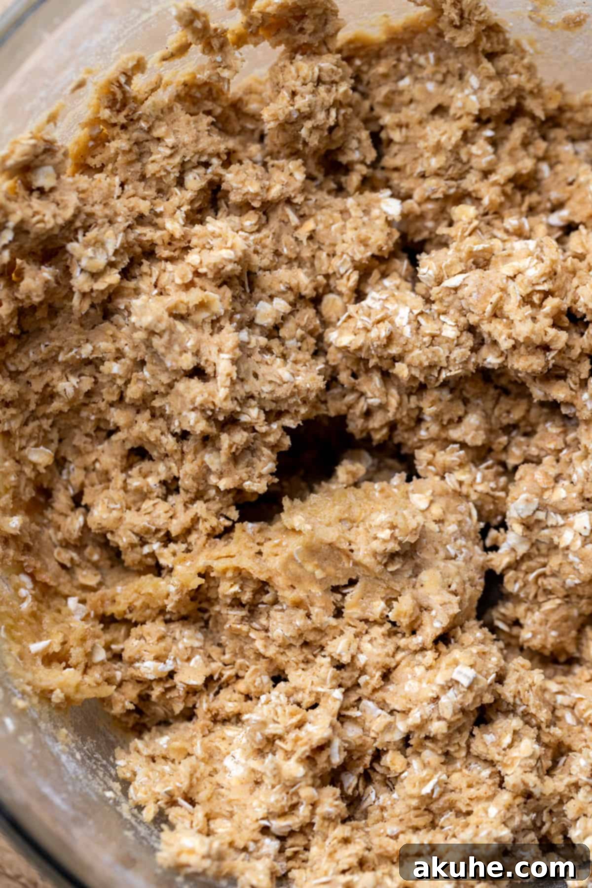 Classic Oatmeal Cream Cookies 5 A bowl of freshly prepared oatmeal cookie dough, ready for chilling.