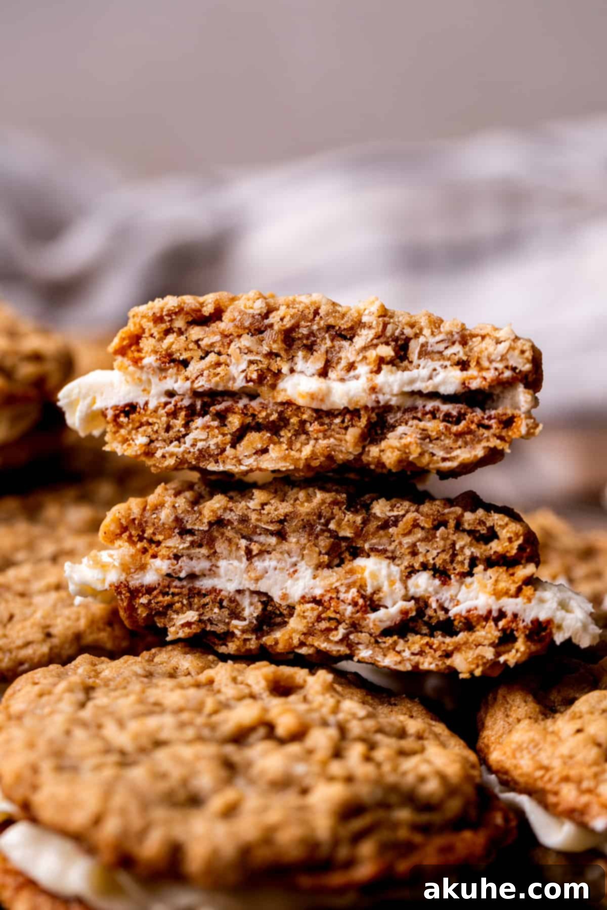 Classic Oatmeal Cream Cookies 10 One homemade oatmeal cream pie perfectly split in half, showcasing the generous filling.