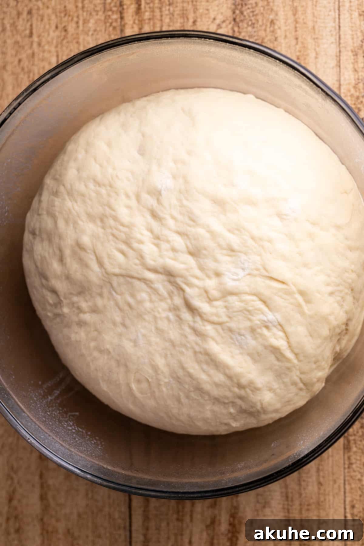Chocolate Cinnamon Rolls 4 Smooth, elastic dough resting in a clear glass bowl, ready for its first rise.