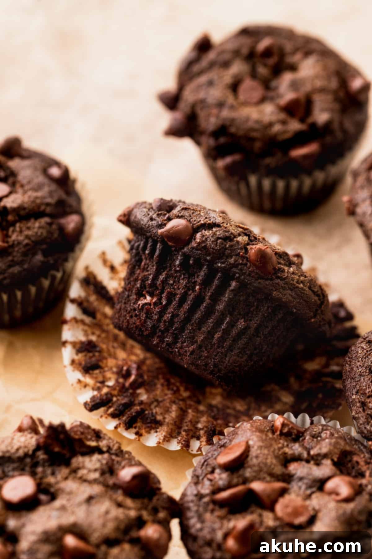 Decadent Triple Chocolate Muffins 7 A muffin opened and on its side.