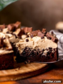 Taking a slice out of the snickers cake.