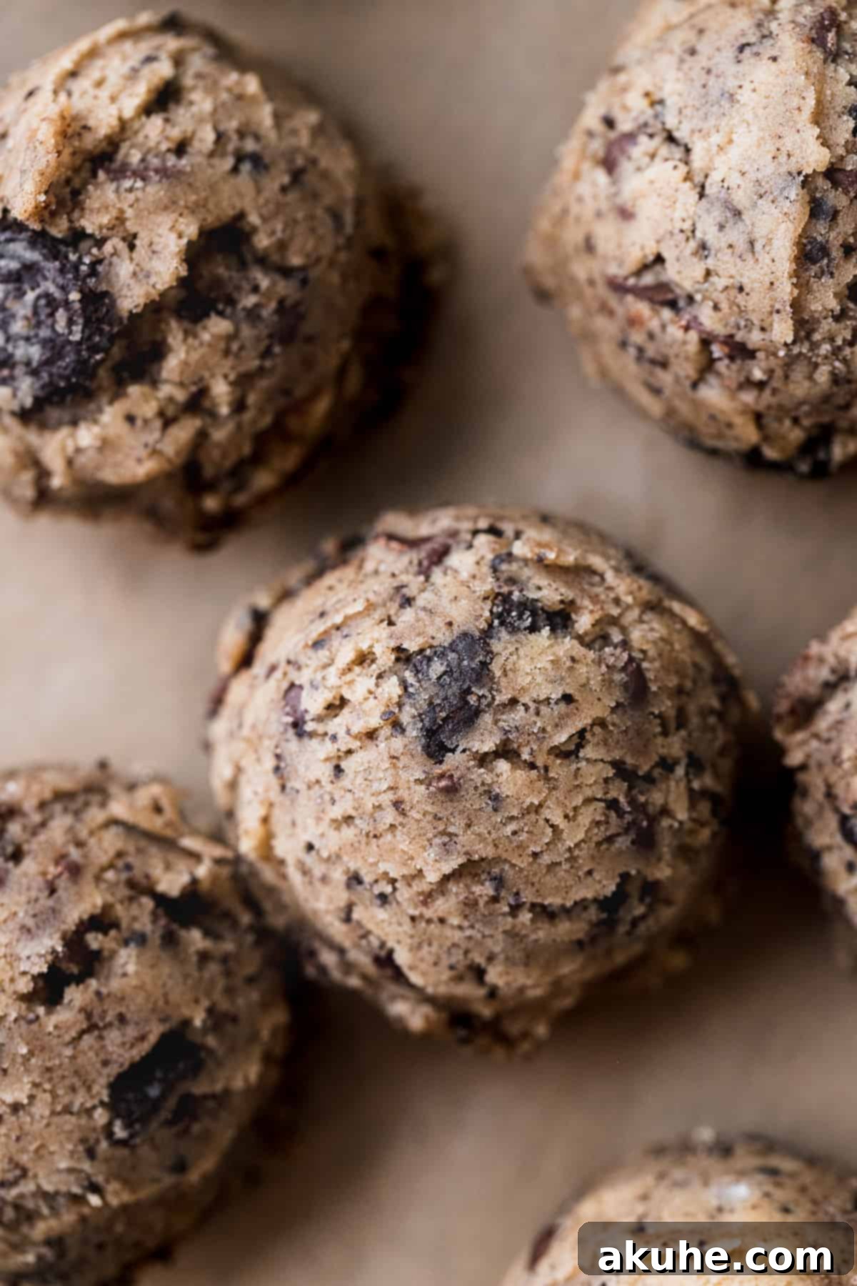 Decadent Oreo Chocolate Chip Cookies 6 Scooped cookie dough balls arranged on parchment paper, chilling before baking.