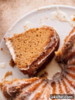 Spiced Apple Cider Donut Cake 11 Piece of apple cider donut cake on its side.