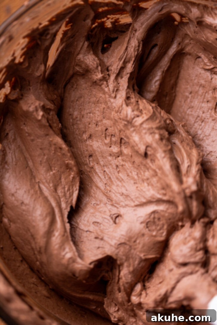 Cheesecake batter after chocolate whipped cream has been gently folded in, showing a slightly lighter, thicker texture.