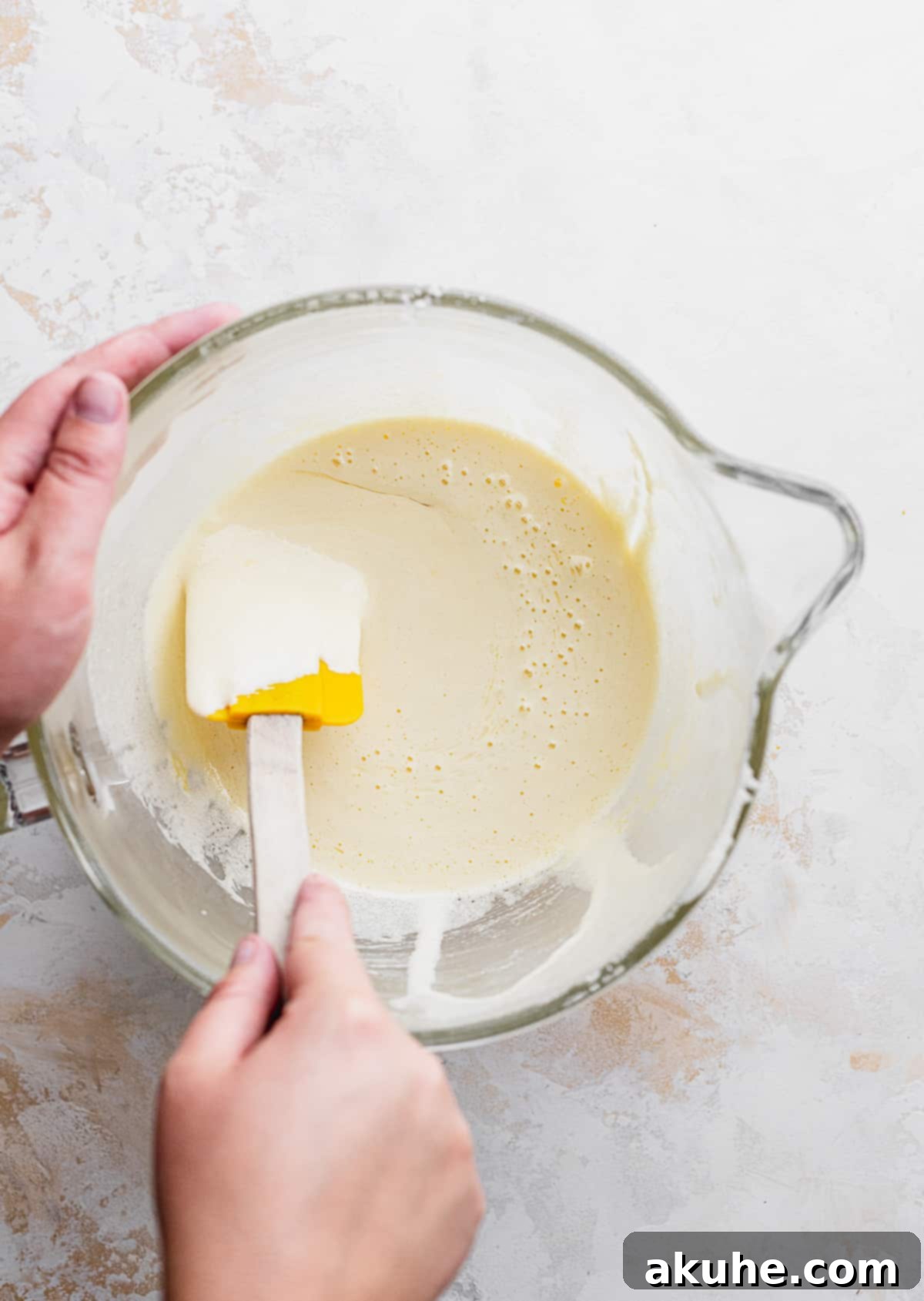 Deep-Roasted Cherry Chocolate Brownies 6 Electric mixer whipping eggs and sugar in a glass bowl for brownie batter