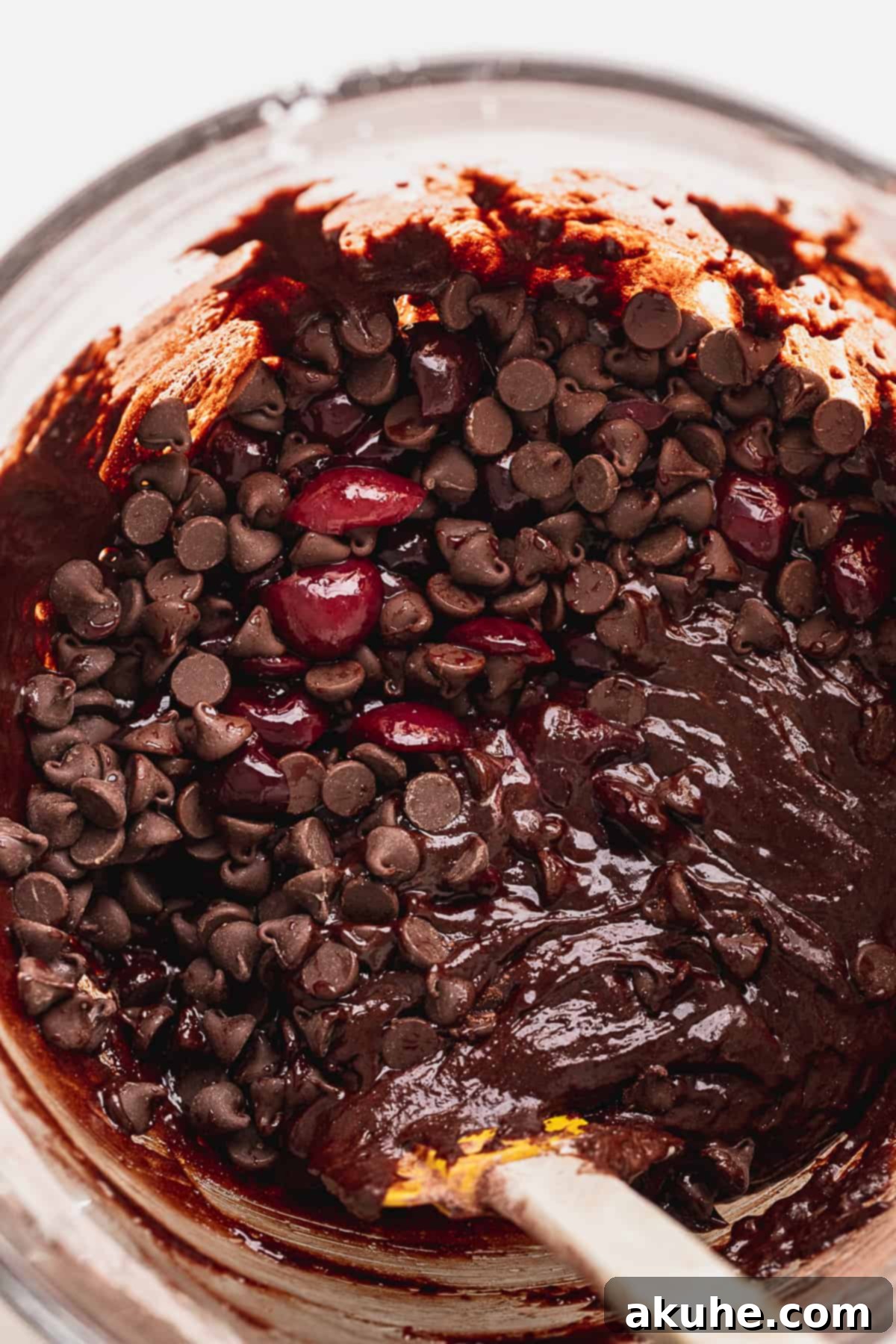 Deep-Roasted Cherry Chocolate Brownies 7 Rich chocolate brownie batter with chocolate chips in a glass mixing bowl
