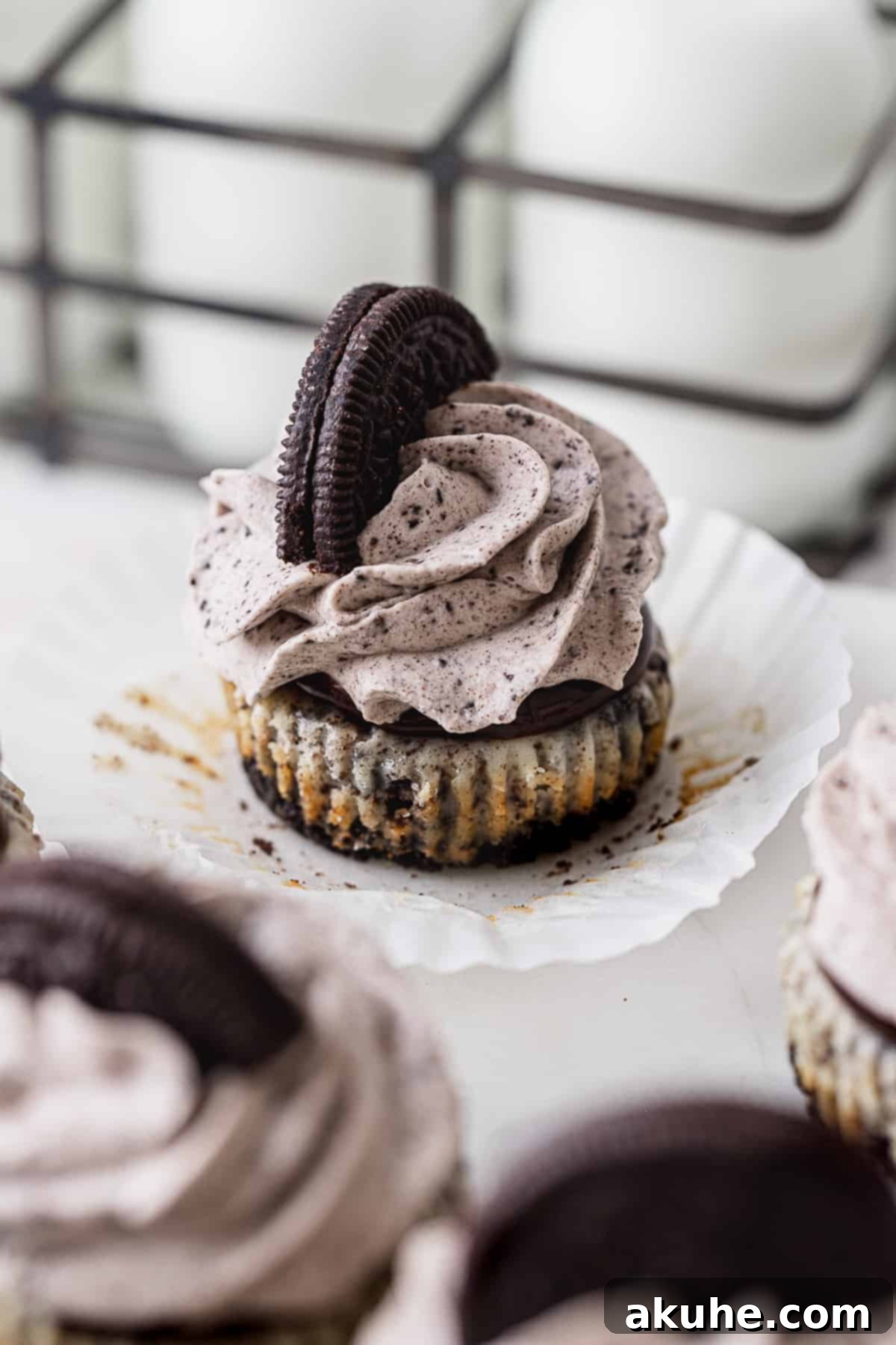 Bite-Sized Oreo Cheesecakes 8 A side shot of mini cheesecakes, showing their perfect form and toppings.