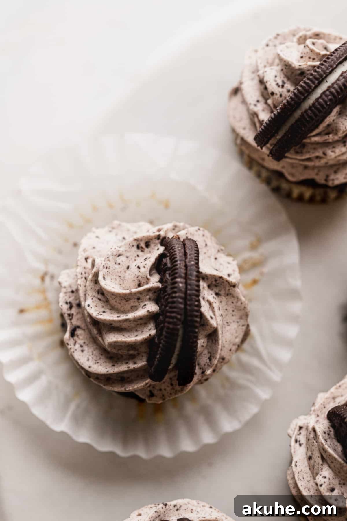 Bite-Sized Oreo Cheesecakes 9 Top view of several mini cheesecakes, showcasing the toppings and decoration.