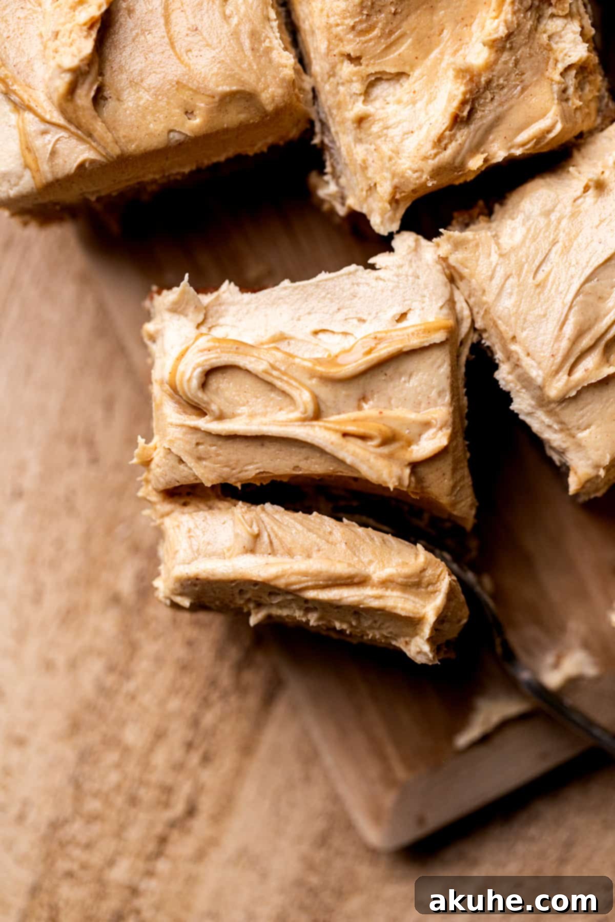 One-Bowl Banana Cake 3 Top-down view of the banana snack cake with a fork inserted, showcasing the soft, frosted layers.