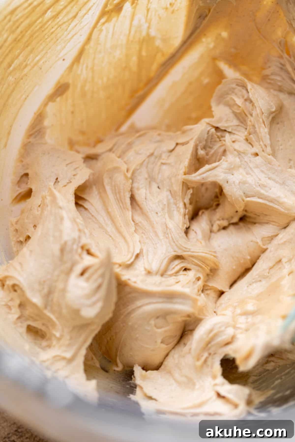 One-Bowl Banana Cake 7 Velvety peanut butter frosting in a glass bowl, ready to be spread.
