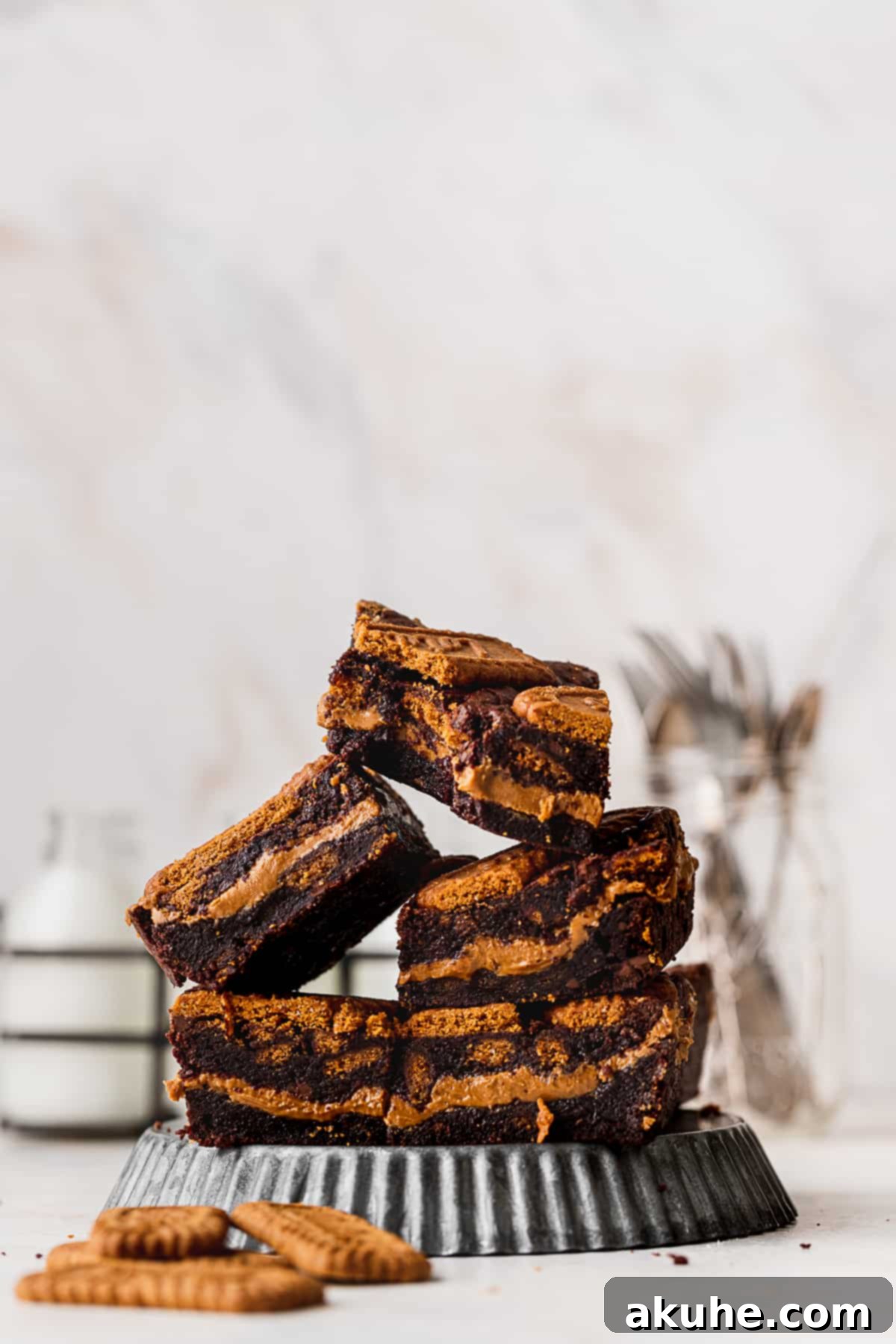 Fudgy Biscoff Swirl Brownies 4 Stack of bars on metal plate.