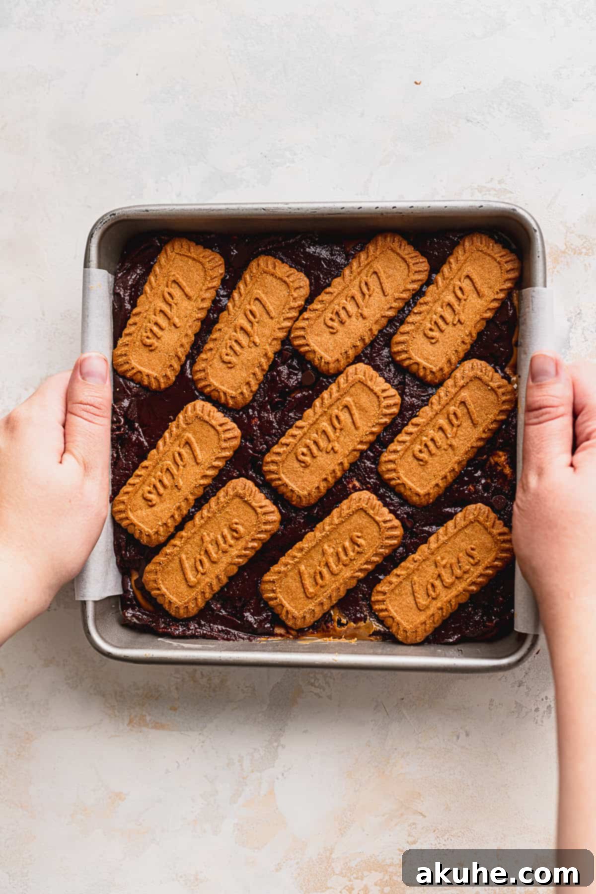 Fudgy Biscoff Swirl Brownies 10 Cookies topped on the brownie batter.
