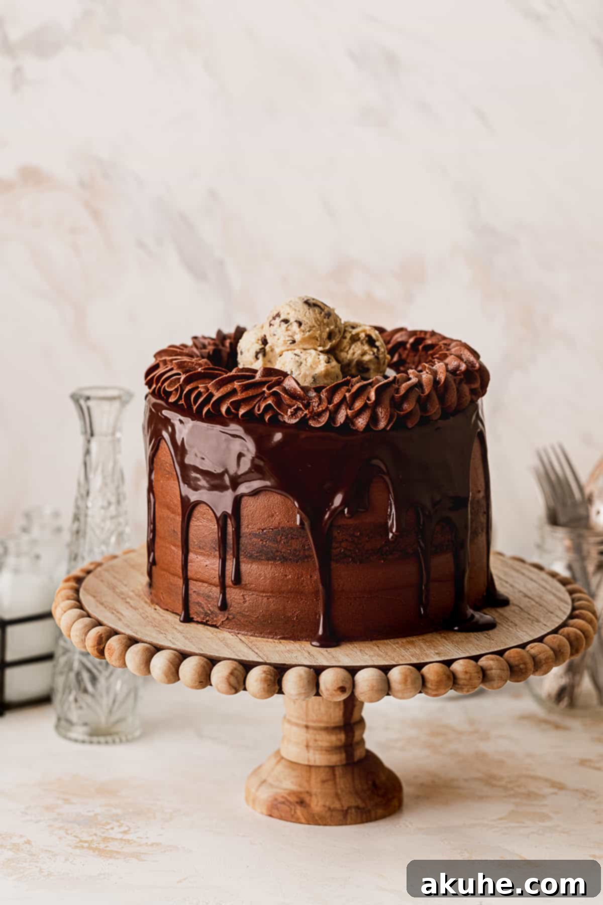 Decadent Cookie Brownie Cake 2 Chocolate brownie cookie cake on a cake stand, ready to be served.