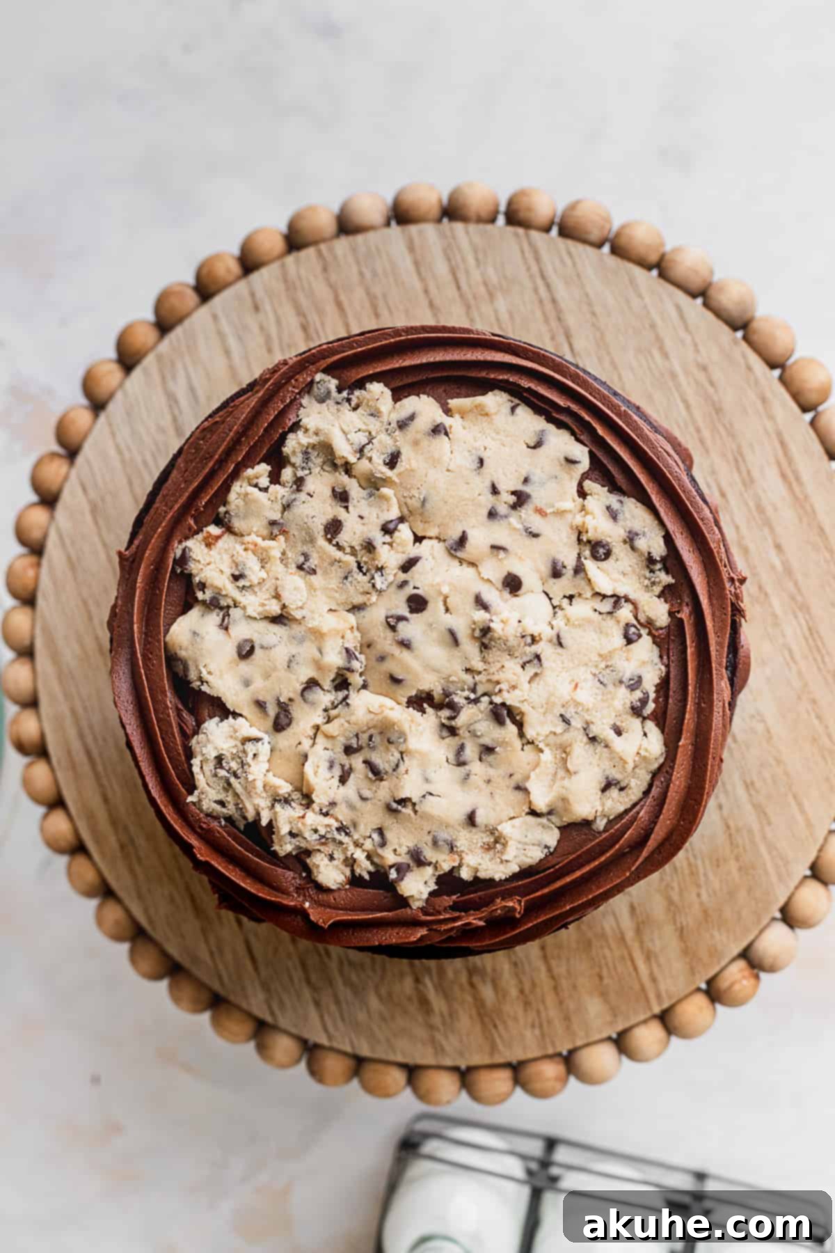 Decadent Cookie Brownie Cake 12 Edible cookie dough placed in discs on a frosted cake layer.