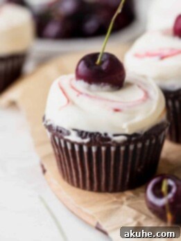 Decadent Black Forest Cupcakes 12 Black Forest cupcake on a wooden board.