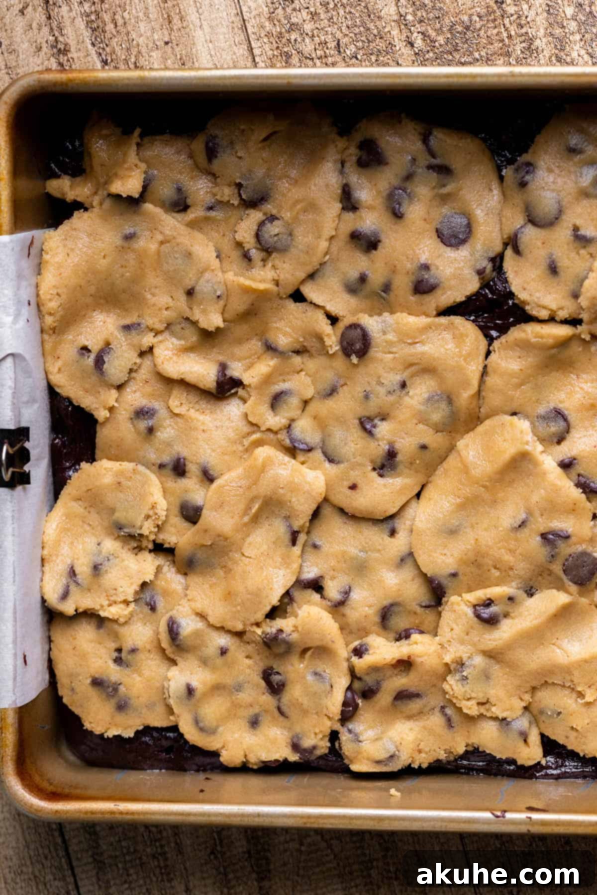 Hybrid Water Jewels 9 Cookie dough discs placed on top of the brownie batter in the pan.