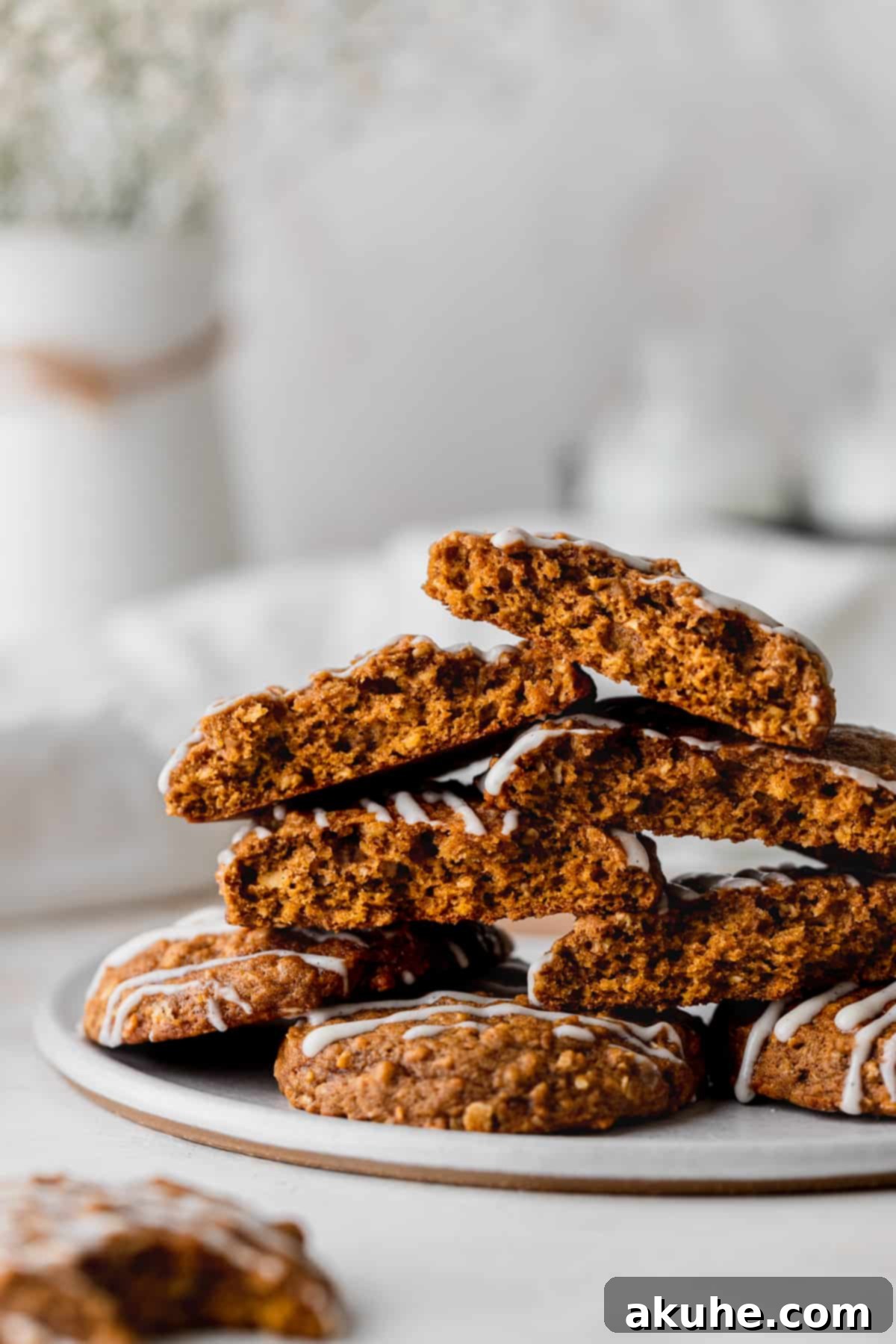 A stack of delicious pumpkin oatmeal cookies, each glazed and ready to be enjoyed.