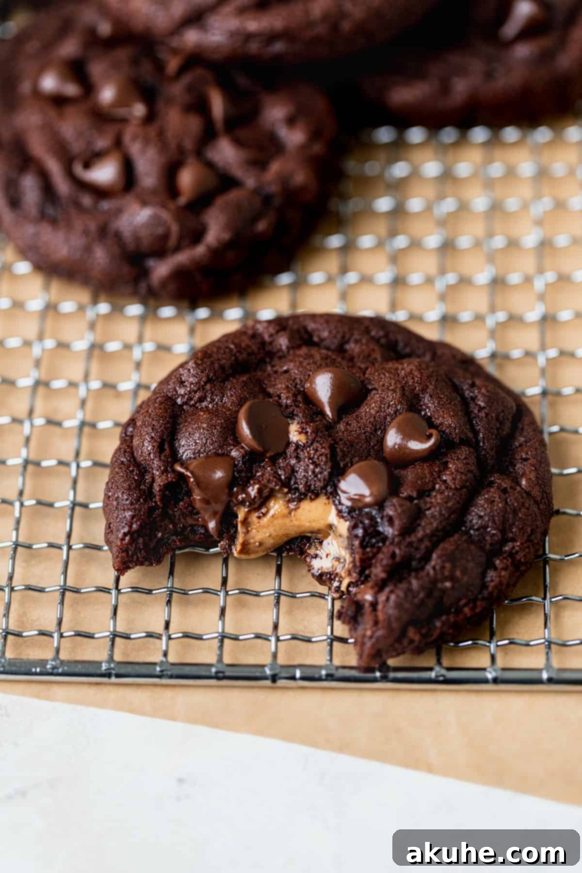 Peanut Butter Stuffed Chocolate Cookies 3 Bite missing from Chocolate peanut butter stuffed cookies.