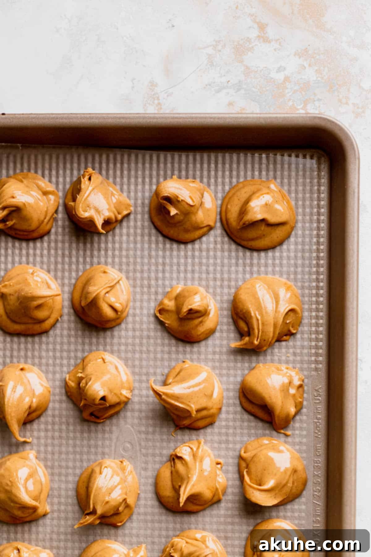 Peanut Butter Stuffed Chocolate Cookies 4 Peanut butter swirls on wax paper.