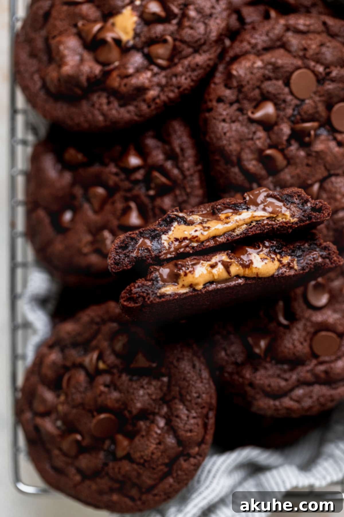 Peanut Butter Stuffed Chocolate Cookies 8 Chocolate peanut butter stuffed cookies with a cookie took apart.
