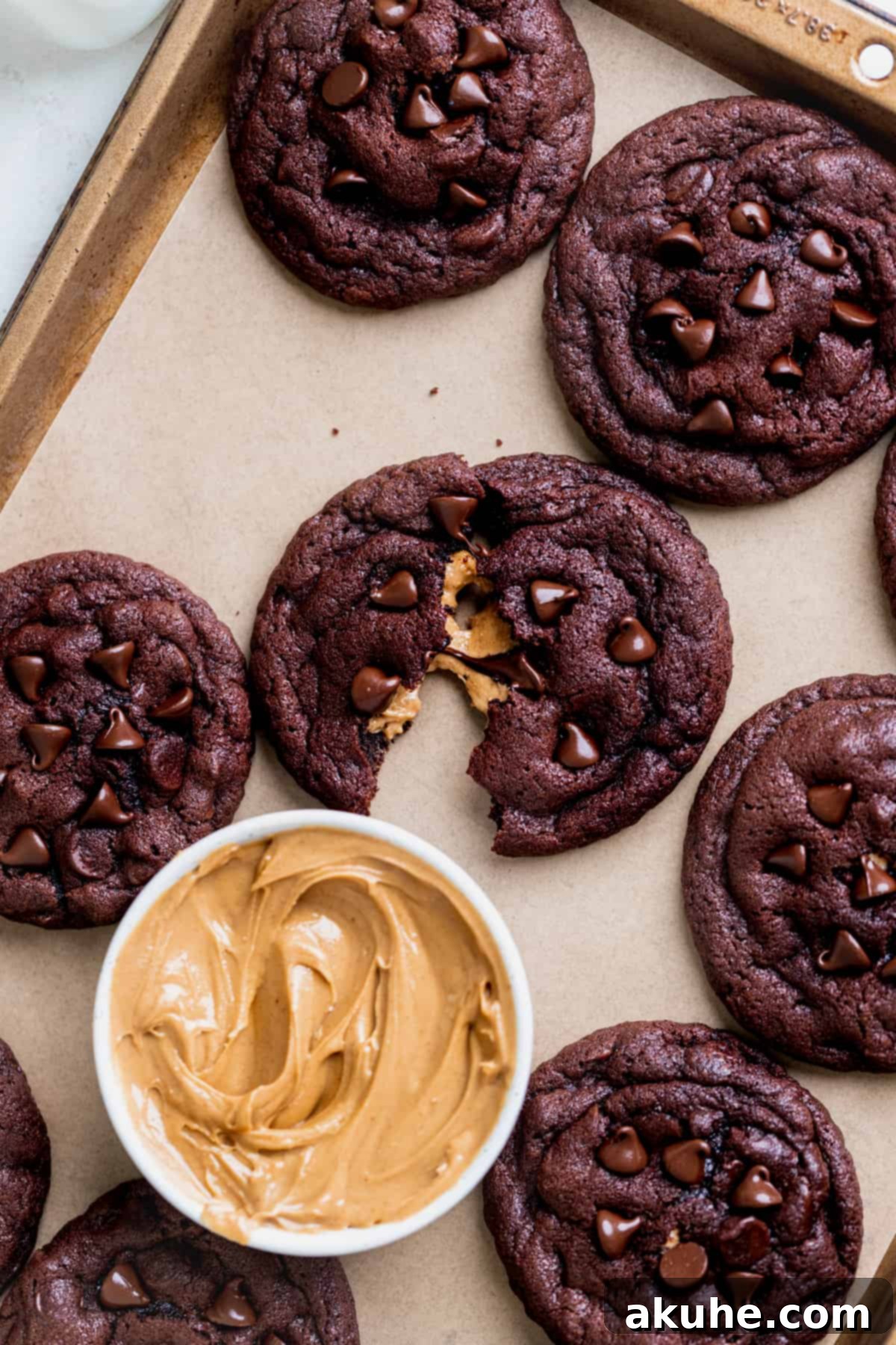 Peanut Butter Stuffed Chocolate Cookies 9 Cookie spread apart on a cookie sheet.