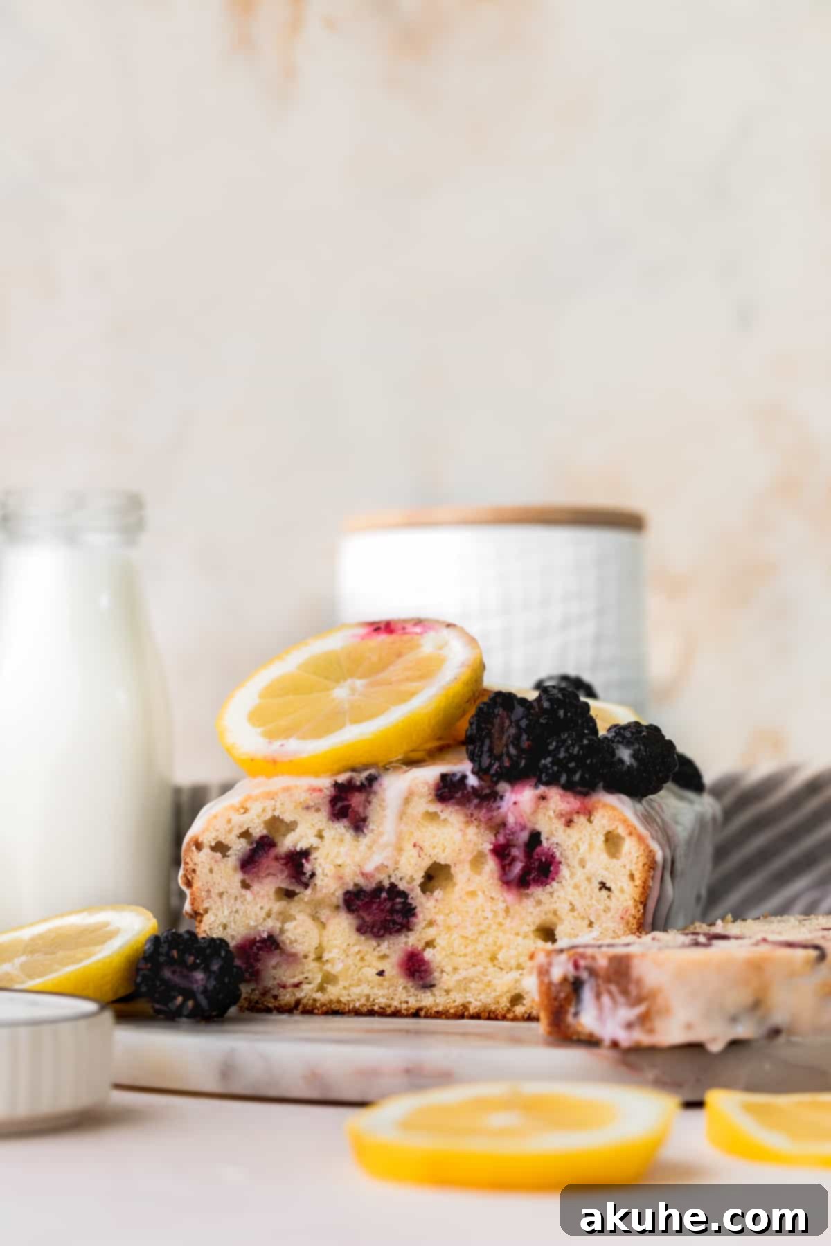 Zesty Blackberry Lemon Loaf 2 Blackberry lemon bread on a marble board.