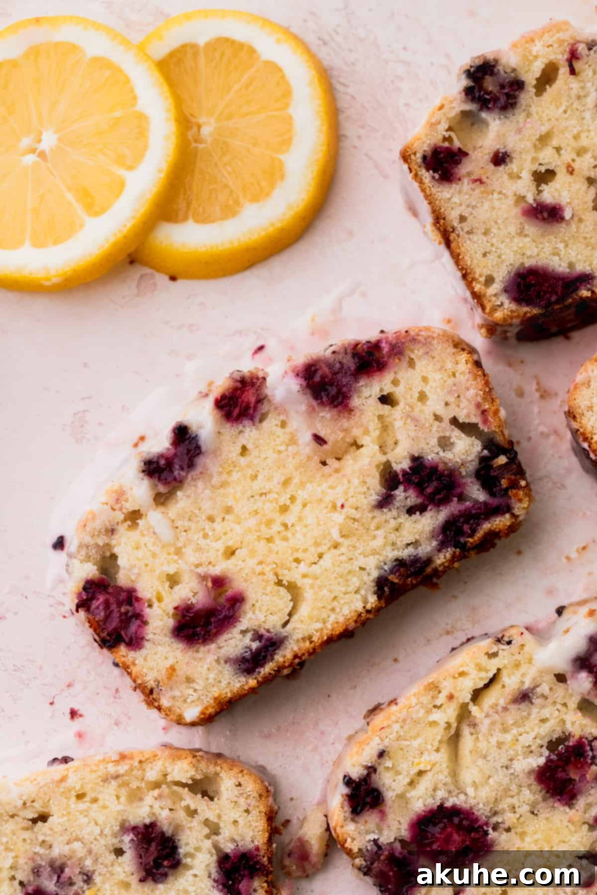 Zesty Blackberry Lemon Loaf 11 Close up of one slice of bread.