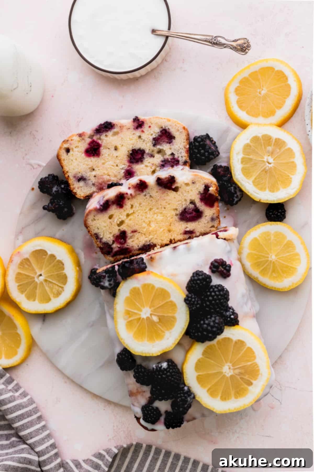 Zesty Blackberry Lemon Loaf 10 Top view of bread with two slices taken off.