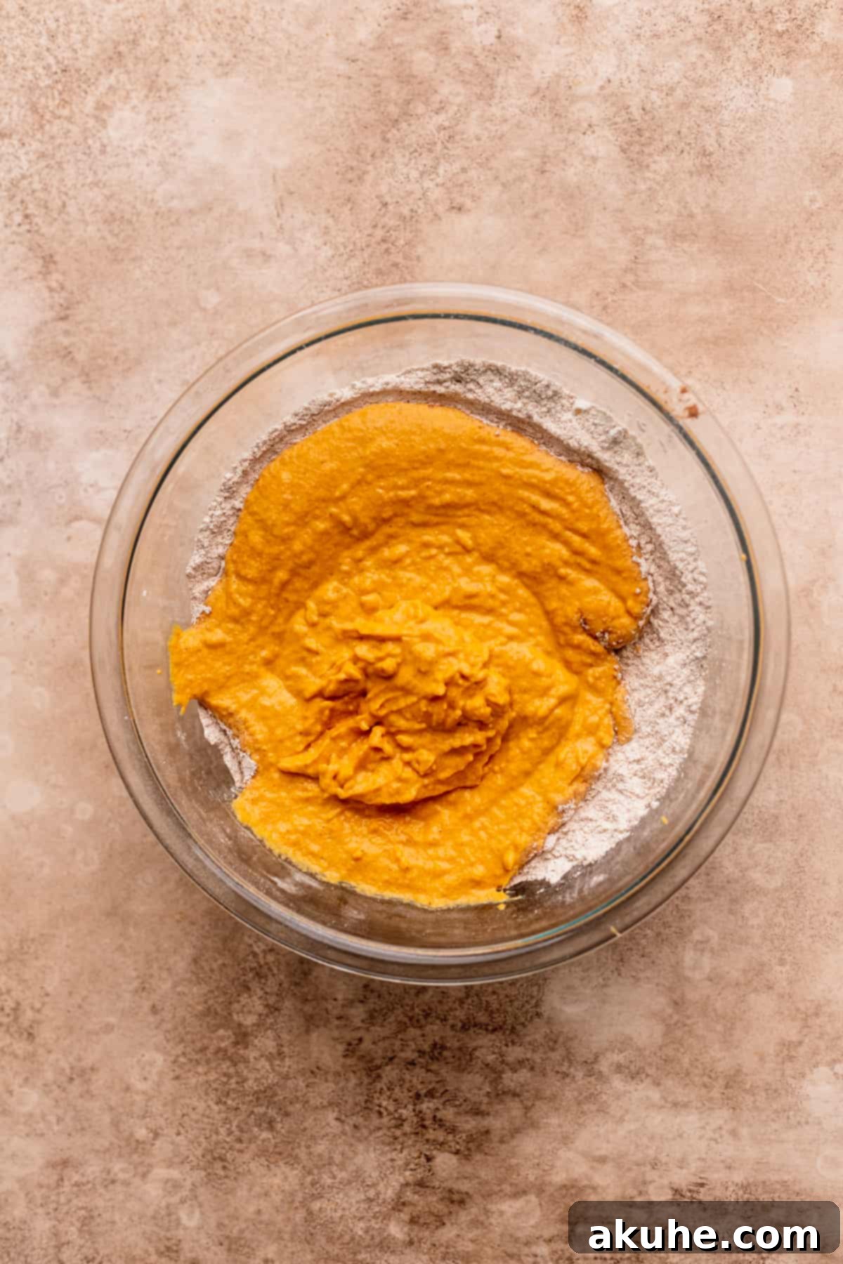 Pouring wet ingredients on top of dry.