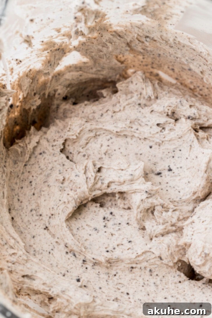 Decadent Oreo Dream Cake 6 Bowl of freshly made Oreo buttercream frosting with fine Oreo crumbs incorporated