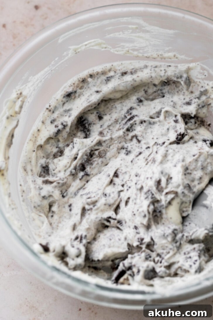 Decadent Oreo Dream Cake 7 Creamy Oreo no-bake pie style filling in a bowl, ready to be layered