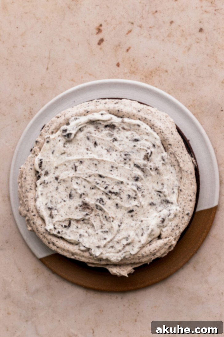 Decadent Oreo Dream Cake 9 Creamy Oreo filling piped onto a chocolate cake layer, creating a delicious central layer